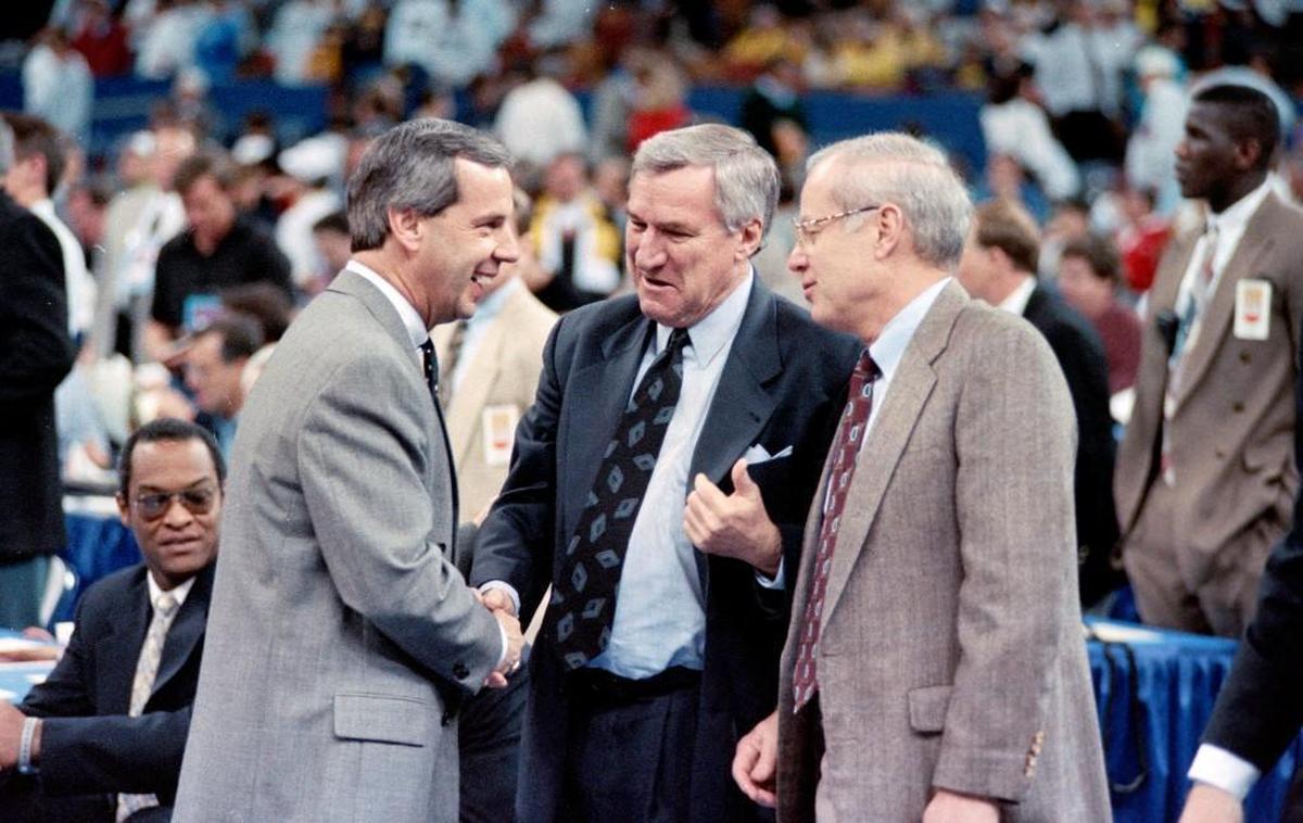 Coaches Roy Williams, left, Dean Smith and UNC assistant coach Bill Guthridge talk before the Tar Heels faced Kansas in the 1993 Final Four in New Orleans.