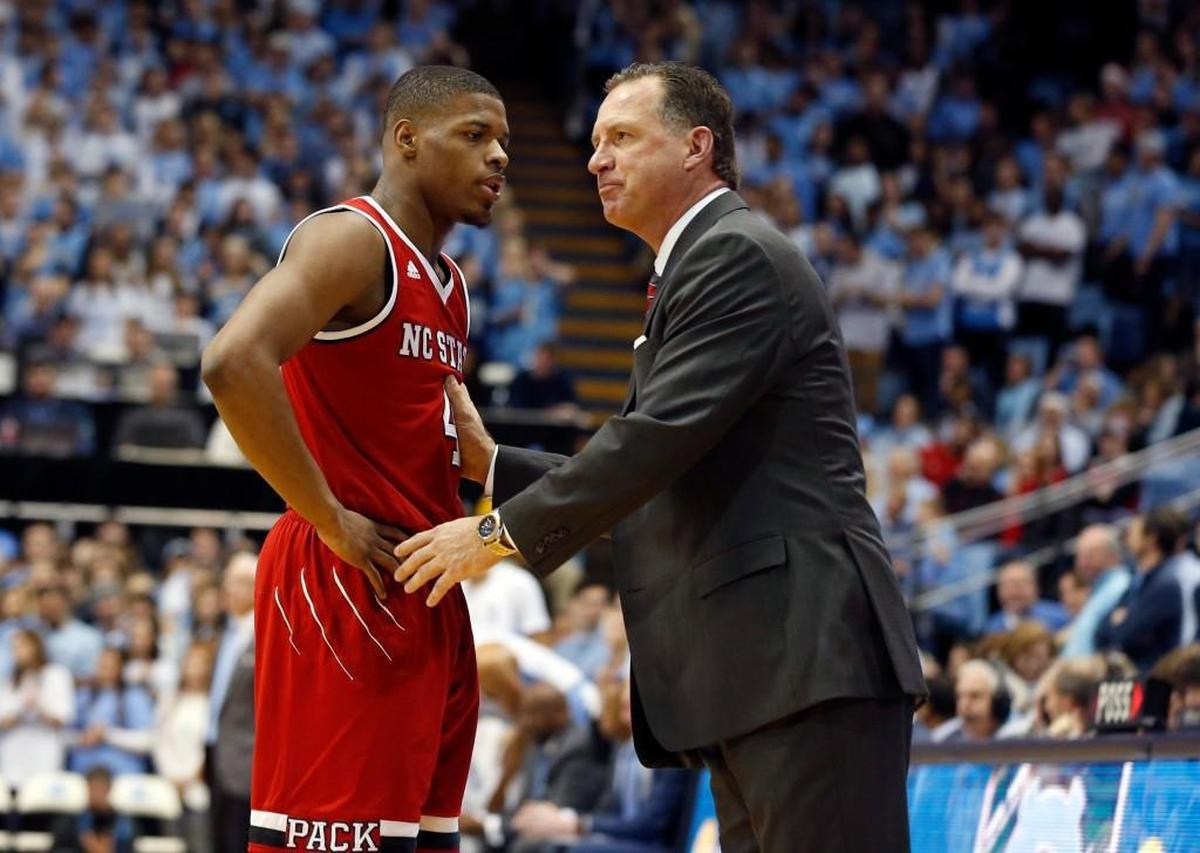 N.C. State coach Mark Gottfried talks with Dennis Smith Jr. during the Wolfpack’s 51-point loss to UNC on Jan 8, 2017.