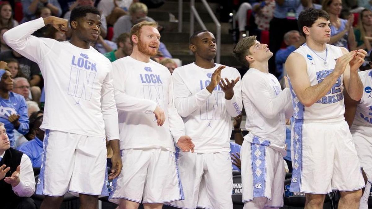 North Carolina reserve players from left, Toby Egbuna (34), Spenser Dalton (43), Justin Coleman (31), Stillman White (30) and Luke Maye (32) react during second half of the Tar Heels game against Florida Gulf Coast during the first round of the NCAA Tournament on Thursday, March 17, 2016 at the PNC Arena in Raleigh, N.C.
