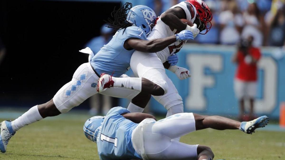 UNC’s Jonathan Smith, left, doesn’t know what to expect from Georgia Tech’s triple-option offense.