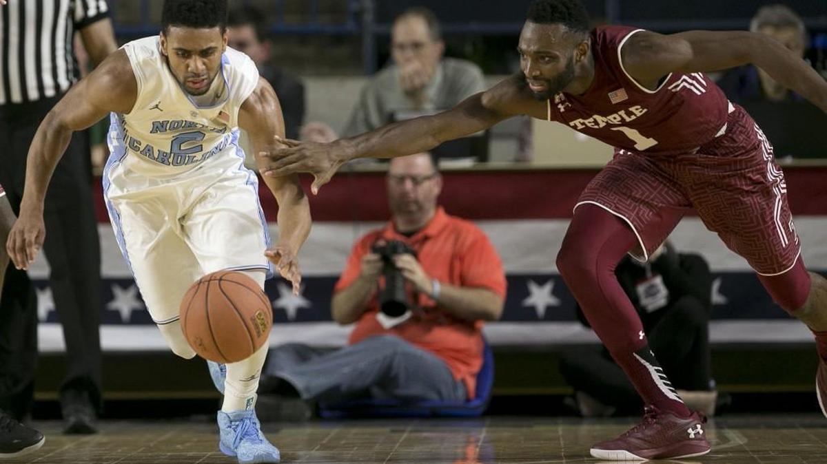North Carolina’s Joel Berry II makes a steal from Temple’s Josh Brownduring the second half at Alumni Hall in Annapolis, Md.