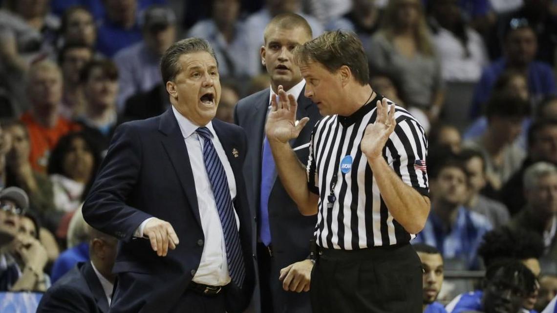 Kentucky coach John Calipari argues a call with referee John Higgins in the South Regional final game against North Carolina in the NCAA tournament in March.