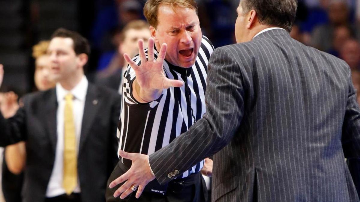 Kentucky head coach John Calipari, right, addresses official John Higgins after being assessed a technical foul during the second half of an NCAA college basketball game against Vanderbilt, in Lexington, Ky., in February 2017.