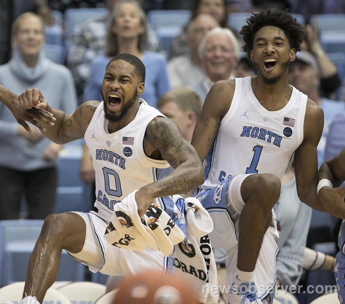 North Carolina’s Seventh Woods (0) and Leaky Black (1) celebrate after a dunk by K.J. Smith (30) to seal the Tar Heels’ 108-58 win on Friday, November 16, 2018 at the Smith Center in Chapel Hill, N.C.
