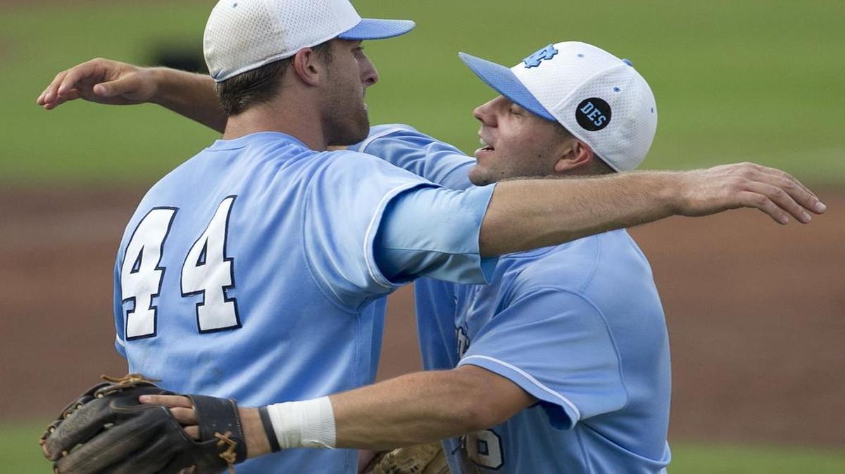 
North Carolina relief pitcher Trevor Kelley (44) is embraces by teammate second baseman Alex Raburn (6) after closing out the ninth inning and securing a 5-3 victory over Virginia Tech during the ACC Baseball Championship on Tuesday, May 19, 2015 at the Durham Bulls Athletic Park in Durham, N.C.
