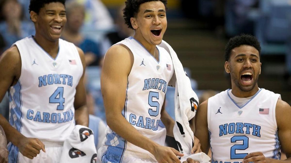 North Carolina’s Isaiah Hicks (4), Marcus Paige (5) and Joel Berry II (2) watch the Tar Heels’ reserve players during the final minute against Davidson on Sunday, December 6, 2015 at the Smith Center in Chapel Hill, N.C.