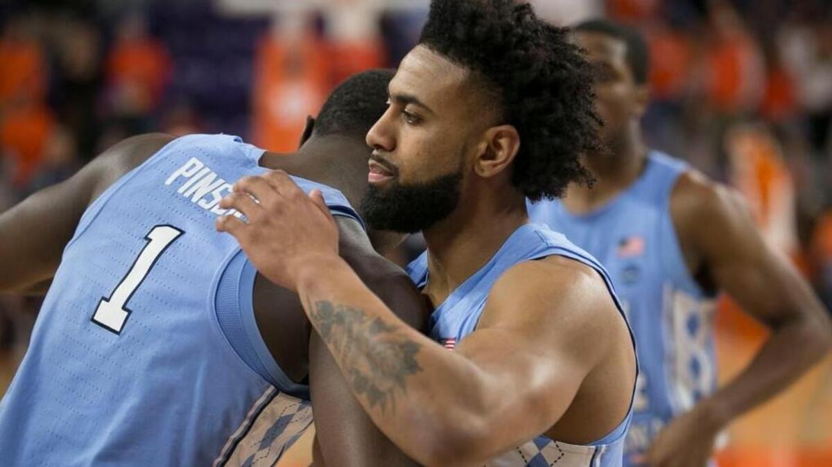 North Carolina’s Joel Berry, right, embraces teammate Theo Pinson, left, prior to their game against Clemson on Jan. 30.