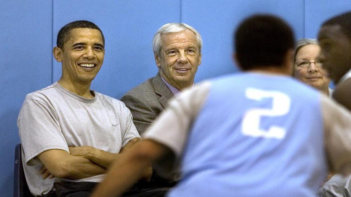 Presidential hopeful Barack Obama, left, and UNC coach Roy Williams watch the UNC men’s team scrimmage during a 2008 practice Tuesday morning at the Smith Center. Staff