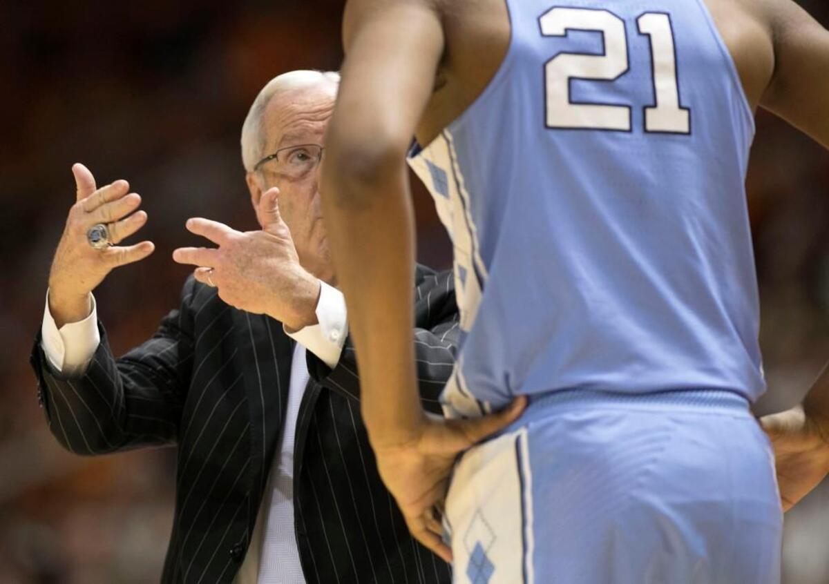 North Carolina coach Roy Williams instructs Sterling Manley (21) during the closing minutes of the second half against Tennessee on Sunday, December 17, 2017 at Thompson-Boling Arena in Knoxville, Tenn.