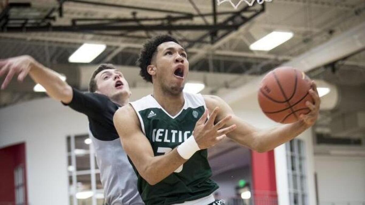 E.J. Montgomery, in green, has narrowed his list to 11, including Duke and UNC.