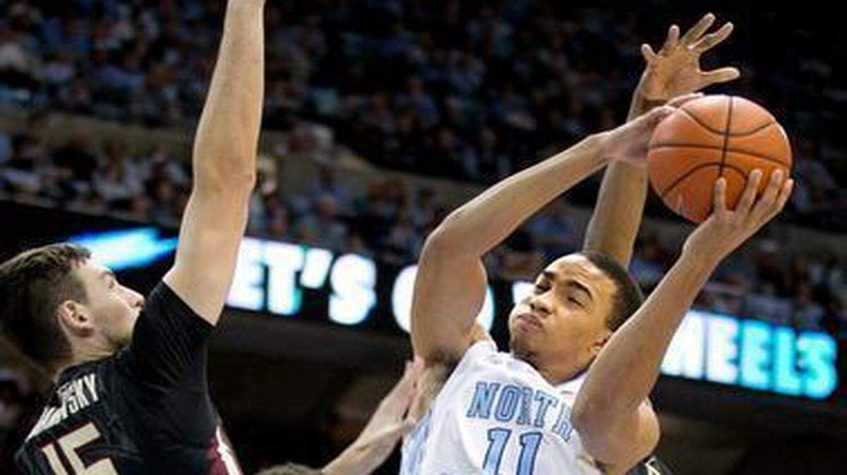 
UNC’s Brice Johnson (11) drives to the basket against Florida State’s Boris Bojanovsky (15) during the second half on Saturday, January 24, 2015 at the Smith Center in Chapel Hill, N.C. Johnson scored 18 points in the Tar Heels’ 78-74 victory.

