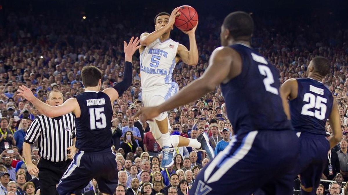 North Carolina's Marcus Paige (5) makes an off balance three-pointer to tie the game with 4.7 seconds left in the 2016 NCAA Men's Basketball Championship at NRG Stadium in Houston, Texas, on April 4.