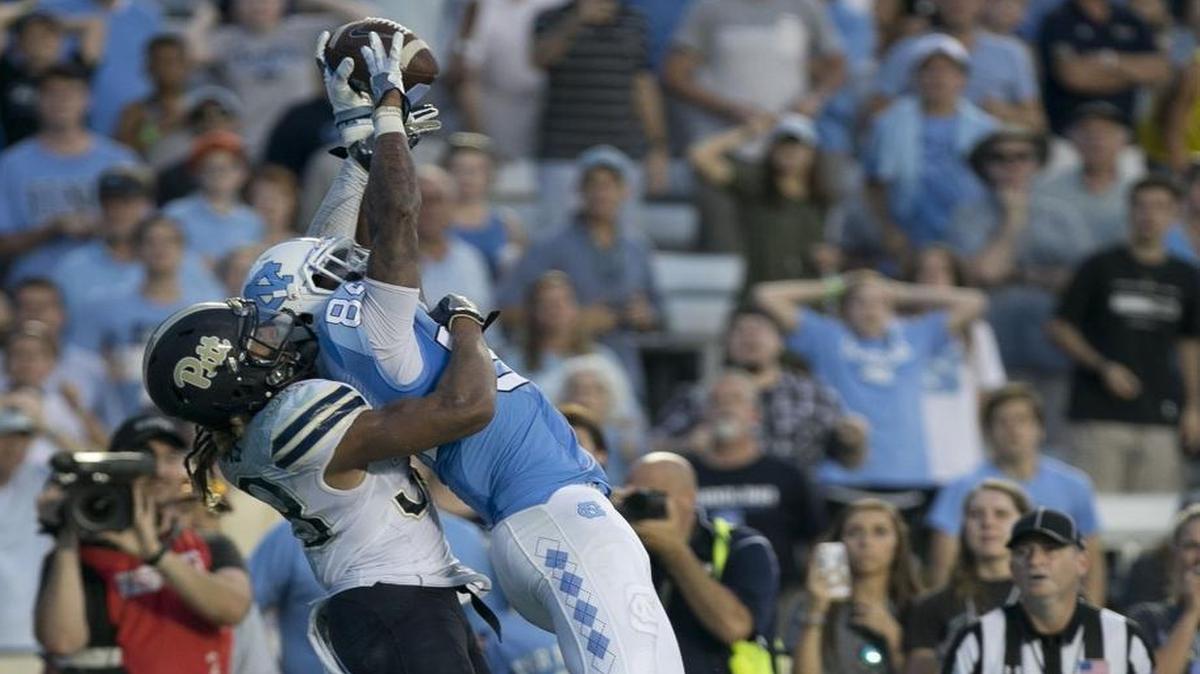 North Carolina’s Bug Howard (84) goes over Pittsburgh’s Ryan Lewis (38) for a 2-yard catch from quarterback Mitch Trubisky for the winning touchdown, giving the Tar Heels a 37-36 victory at Kenan Stadium.