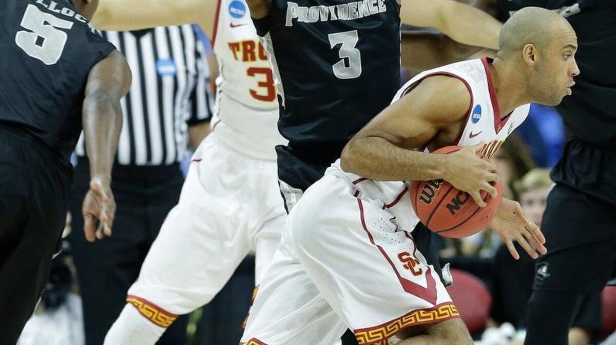 Southern California guard Julian Jacobs (12) moves by Providence guard Kris Dunn (3) during Thursday’s NCAA game in Raleigh. Dunn and the Friars face UNC Saturday night. Dunn is one of the best guards in the country.