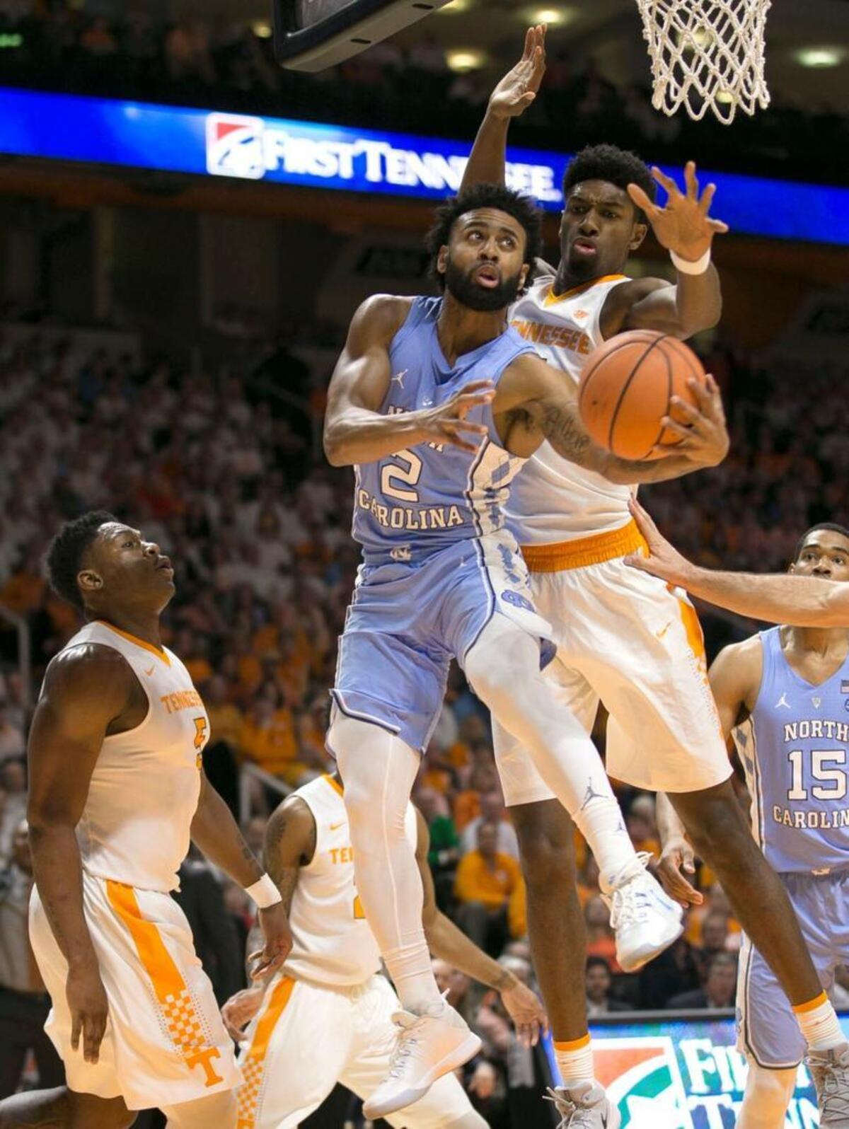 North Carolina’s Joel Berry II (2) drives to the basket against Tennessee’s Kyle Alexander (11) during the second half on Sunday, December 17, 2017 at Thompson-Boling Arena in Knoxville, Tenn. Berry lead all scores with 21 points and the Tar Heels’ to a 78-73 victory.