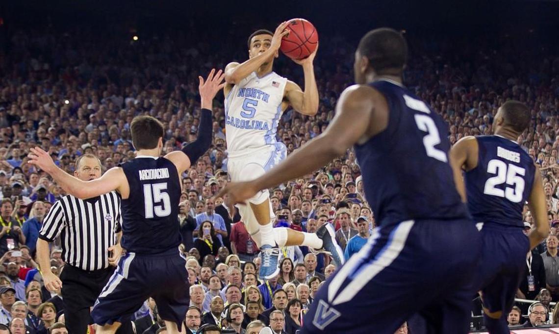 North Carolina’s Marcus Paige, middle, makes an off balance three-pointer to tie the NCAA tournament title game against Villanova with 4.7 seconds left on April 4, 2016.