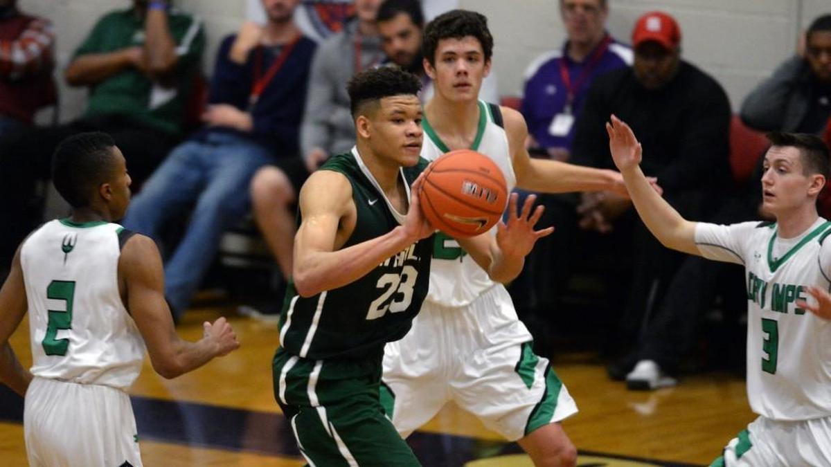 Kevin Knox (23) of Tampa Catholic is surrounded by the Cary Imps defense during the John Wall Holiday Invitational Tournament at Broughton High School on Dec. 27, 2016. Knox scored 38 points in the 71-69 win.