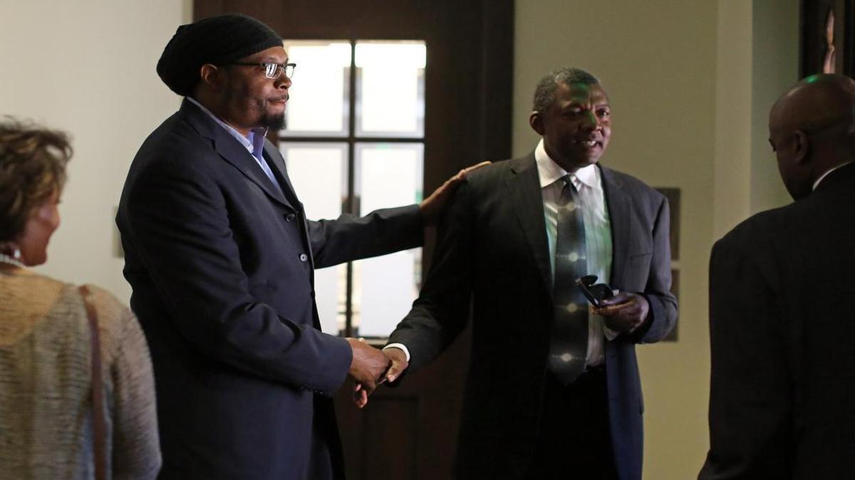 
Sam Perkins, a UNC basketball player from 1980 to 1984, left, speaks with former player Al Wood (UNC 77-81) at a reception after the funeral for former UNC coach Bill Guthridge on Monday at the Chapel of the Cross Episcopal Church in Chapel Hill.
