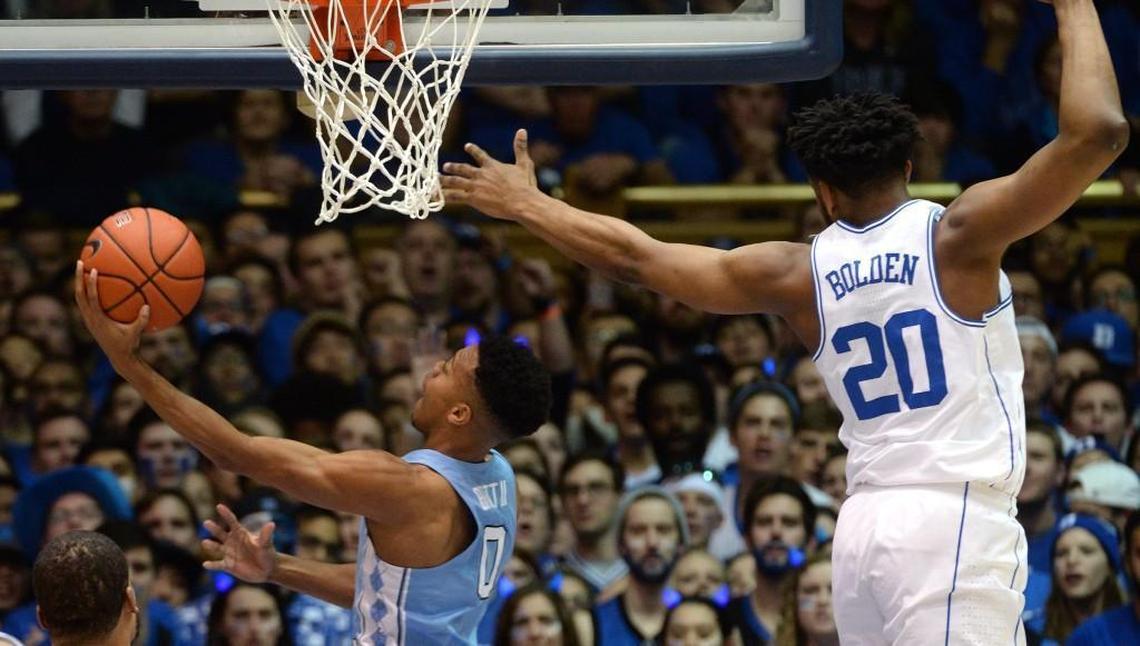 UNC guard Nate Britt (0) goes in to score as Duke center Marques Bolden (20) defends in the first half of play at Cameron Indoor Stadium in Durham on Feb. 9, 2017.
