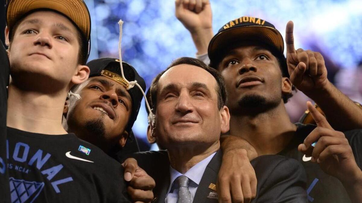 Duke head coach Mike Krzyzewski stands with, left to right, Grayson Allen, Quinn Cook and Justise Winslow after beating Wisconsin in the 2015 national title game. It’s been 25 years since multiple Triangle teams have made the Final Four in the same season.