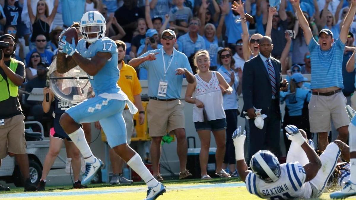 UNC’s Anthony Ratliff-Williams, left, hauls in a touchdown pass against Duke.