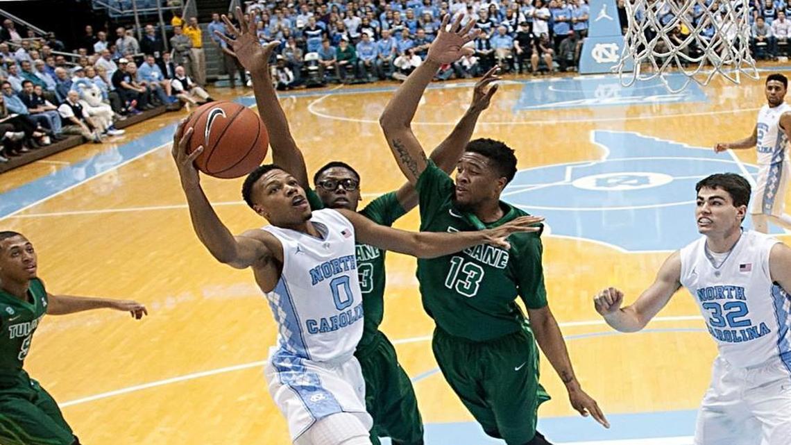 North Carolina’s Nate Britt (0) drives to the basket against Tulane’s Malik Morgan (13) during the first half on Wednesday, December 16, 2015 at the Smith Center in Chapel Hill, N.C.