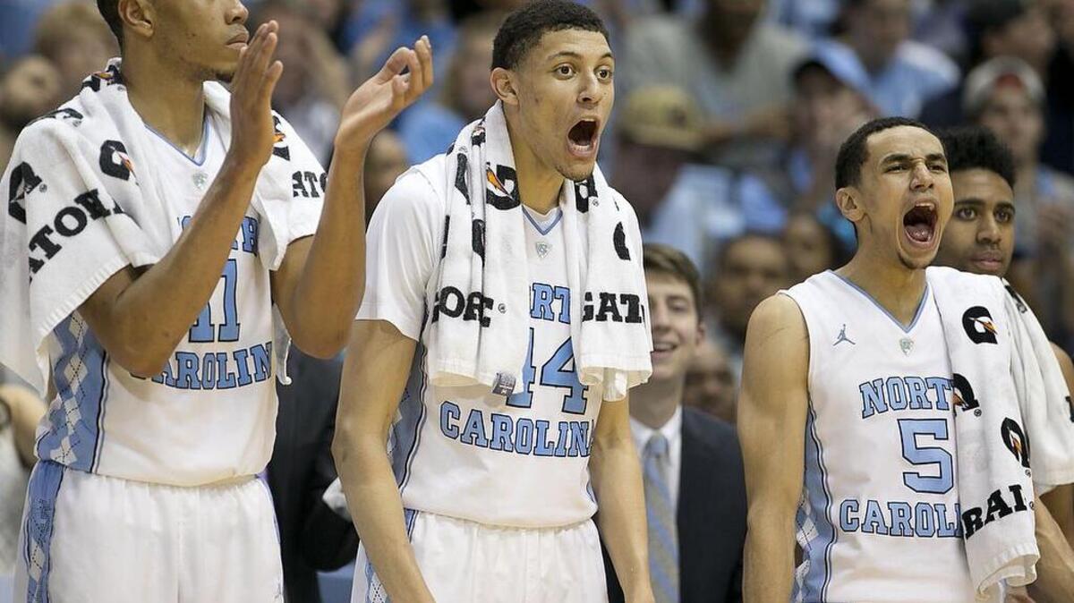 North Carolina’s Brice Johnson (11), Justin Jackson (44) and Marcus Paige (5) react after a basket by teammate Luke Maye (32) during the final minute of play against Miami on Saturday, February 20, 2016 at the Smith Center in Chapel Hill, N.C.