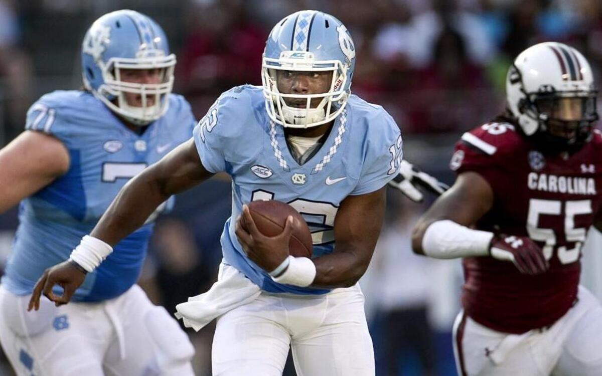 
North Carolina quarterback Marquise Williams (12) rushes for seven yards in the second quarter against South Carolina in the Belk College Kickoff on Thursday September 3, 2015 at Bank of American Stadium in Charlotte, N.C.
