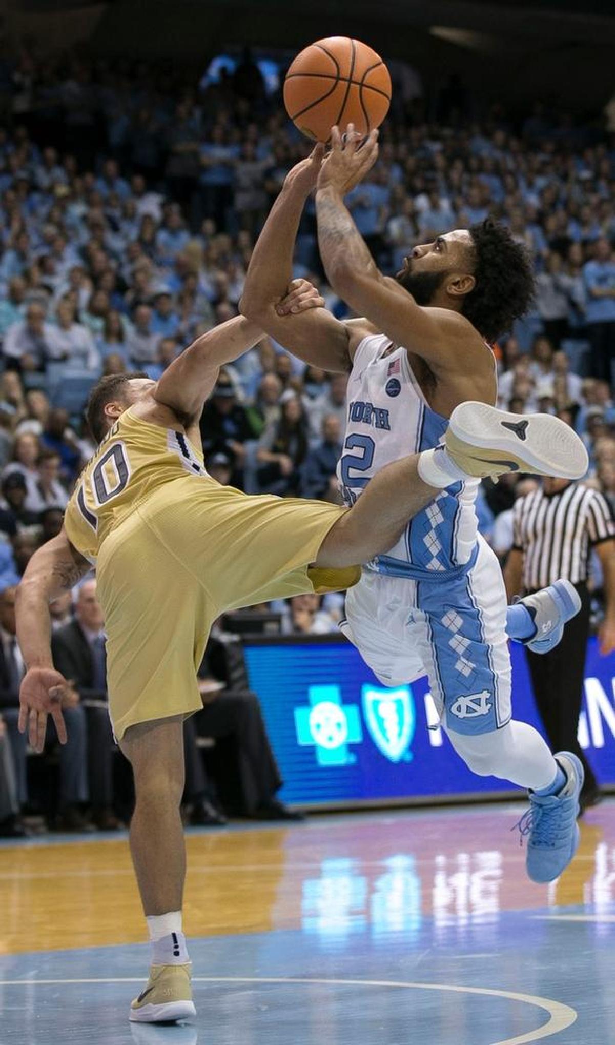 North Carolina’s Joel Berry II (2) draws a hard foul from Georgia Tech’s Jose Alvarado (10) during the second half on Saturday, January 20, 2018 at the Smith Center in Chapel Hill, N.C.