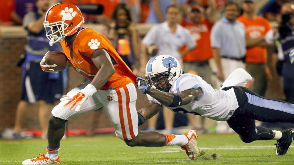 Clemson Artavis Scott (2) works his way to the end zone for a touchdown past UNC's Sam Smiley (3) after a pass completion from quarterback Deshaun Watson in the fourth quarter on Saturday, September 27, 2014 at Memorial Stadium in Clemson, S.C.