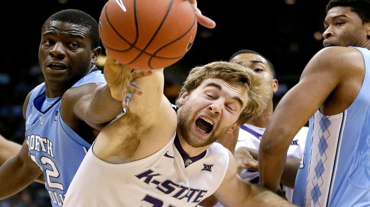 North Carolina's Joel James, left, and Kansas State's Austin Budke (35) chase a loose ball during the first half of an NCAA college basketball game Tuesday, Nov. 24, 2015, in Kansas City, Mo.