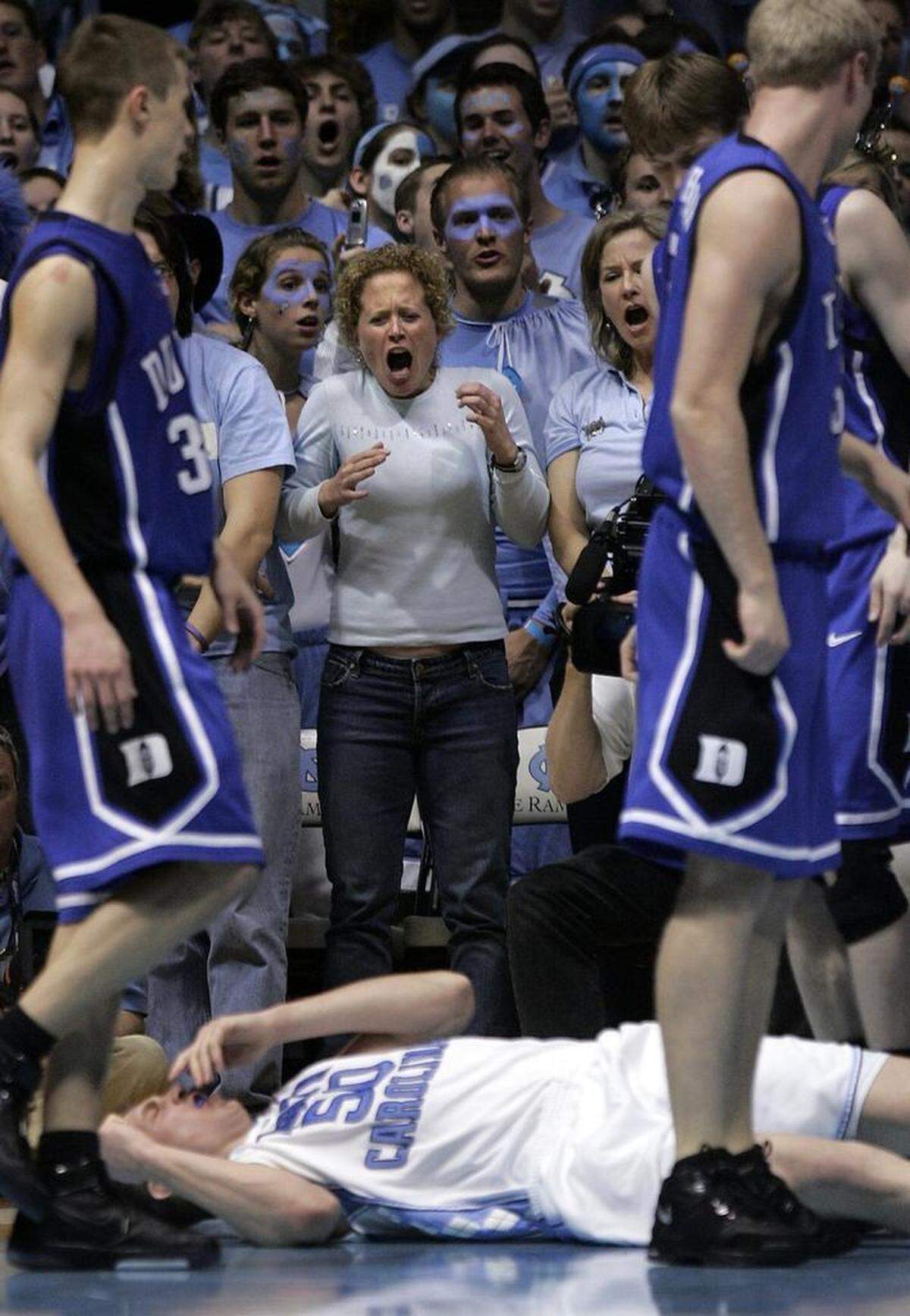 UNC fans react after a flagrant foul by Duke’s Gerald Henderson, who knocked down UNC’s Tyler Hansbrough on March 4, 2007.