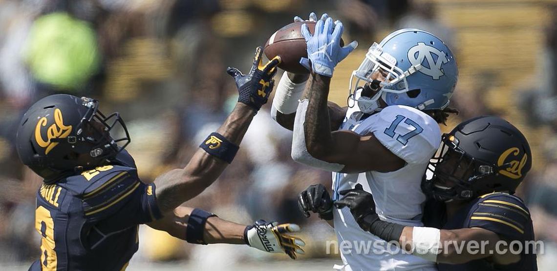 North Carolina’s Anthony Ratliff-Williams (17) pulls in a 44-yard pass from Nathan Elliott between California’s Camryn Bynum (24) and Quentin Tartabull (28) in the third quarter on Saturday, Sept. 1, 2018, at Memorial Stadium in Berkeley, Ca.