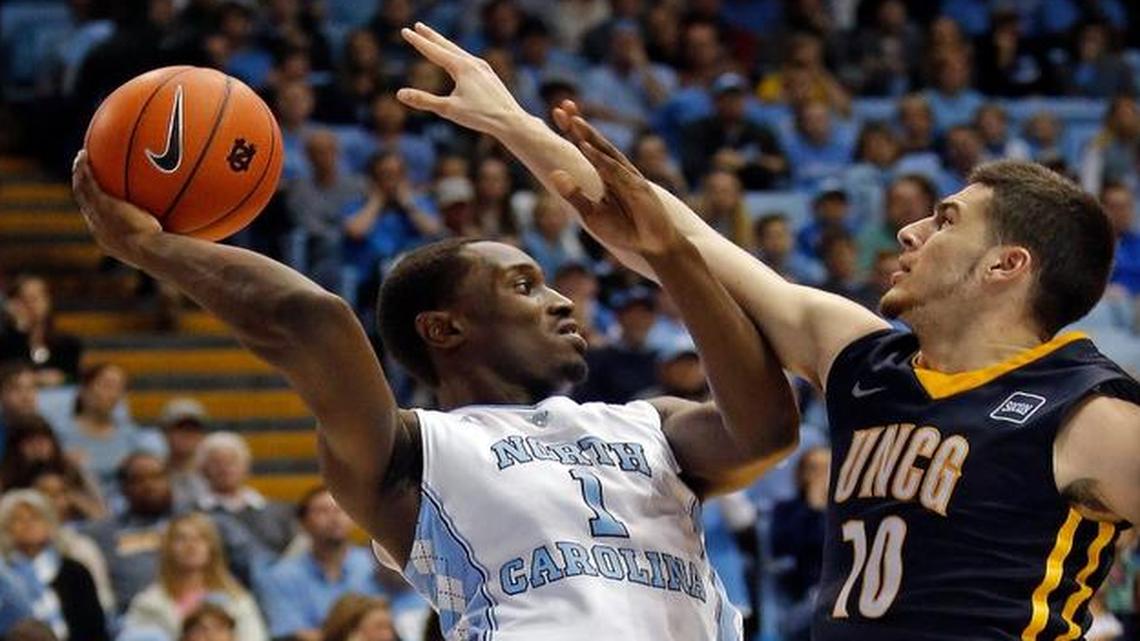 The North Carolina Tar Heels' Theo Pinson (1) is guarded by the UNC-Greensboro Spartans' Francis Alonso (10) during the second half of an NCAA college basketball game played between the UNC Tar Heels and UNCG at the Smith Center in Chapel Hill, NC on Dec. 28, 2015. UNC beat UNC-G 96-63.