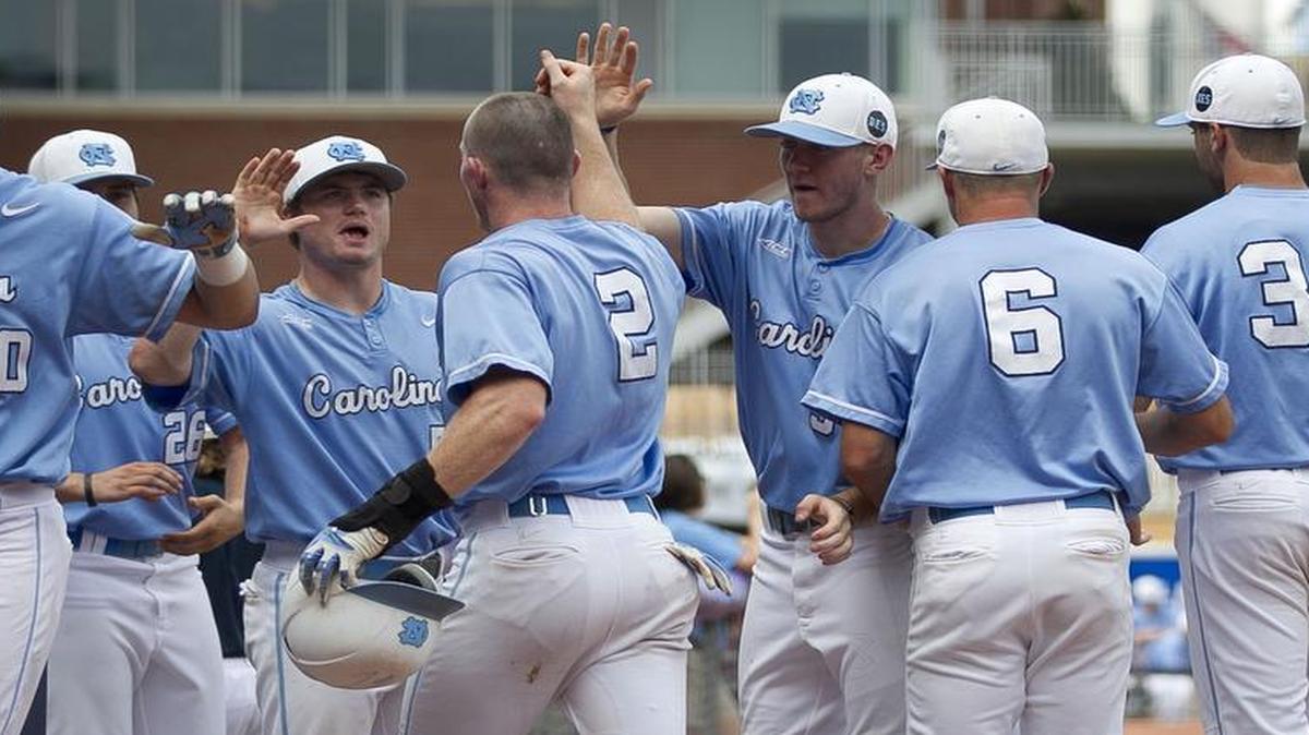 
North Carolina’s Adam Pate (2) is welcomed to the dugout after scoring to give the Tar Heels’ a 2-1 lead against Virginia Tech in the bottom of the fourth inning on a single by Logan Warmoth (7) during the ACC Baseball Championship on Tuesday at the Durham Bulls Athletic Park in Durham.
