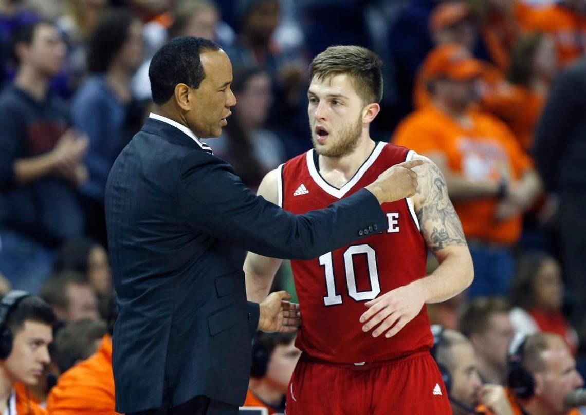 N.C. State's head coach Kevin Keatts talks with Braxton Beverly (10) during the second half of Virginia's 68-51 victory over N.C. State at John Paul Jones Arena in Charlottesville, VA on Jan. 14, 2018.