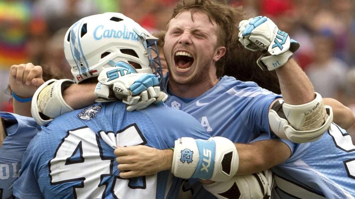 Chris Cloutier #45 and William McBride #14 of the North Carolina Tar Heels react after defeating the Maryland Terrapins in overtime in the NCAA Division I Men's Lacrosse Championship at Lincoln Financial Field on May 30, 2016 in Philadelphia, Pennsylvania. The Tar Heels defeated the Terrapins 14-13. (Photo by Mitchell Leff/Getty Images)
