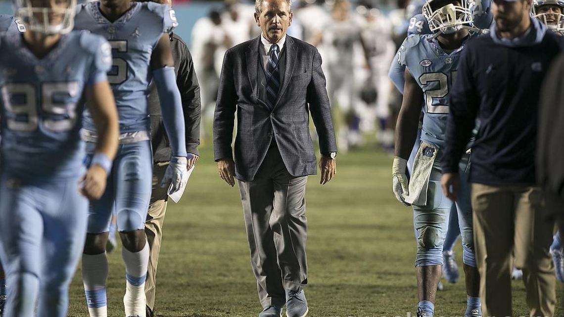 North Carolina athletic director Bubba Cunningham leaves the field with the football team following their second win of the season against Western Carolina on Saturday, November 17, 2018 at Kenan Stadium in Chapel Hill.