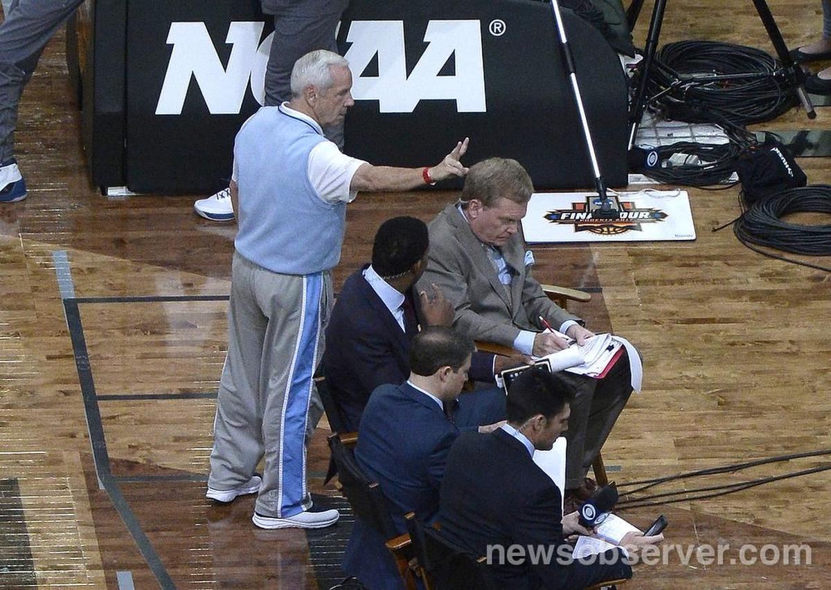 North Carolina coach Roy Williams jokes with Pete Gillen on Friday, March 31, 2017 at the NCAA Final Four in Glendale, Az. in the University of Phoenix Stadium.