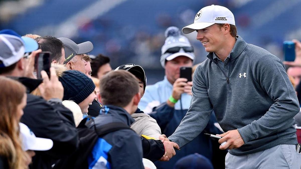 
US golfer Jordan Spieth meets fans on the 3rd tee during a practice round on The Old Course at St Andrews in Scotland, on July 15, 2015, ahead of The 2015 Open Golf Championship which runs July 16-19. US golfer Jordan Spieth arrives at St Andrews with a shot at becoming just the second man - after Ben Hogan in 1953 - to win the first three majors of the year, setting up the mouthwatering prospect of him pulling off the Grand Slam at the PGA Championship next month.
