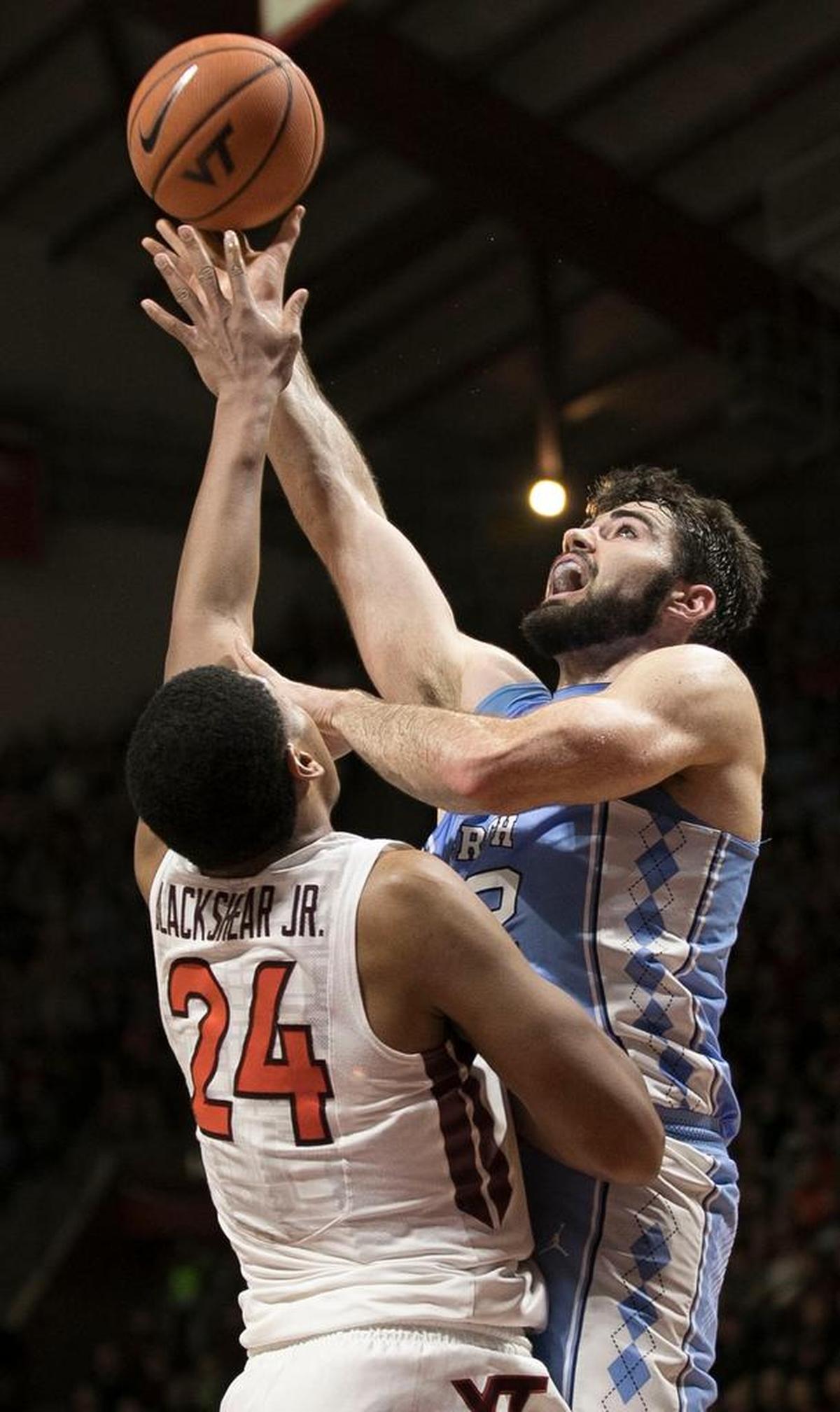North Carolina’s Luke Maye (32) puts up a shot against Virginia’s Tech’s Kerry Blackshear Jr. (24) during the second half on Monday, January 22, 2018 at Cassell Coliseum in Blacksburg, Virginia. Maye scored 23 points in the Tar Heels’ loss.