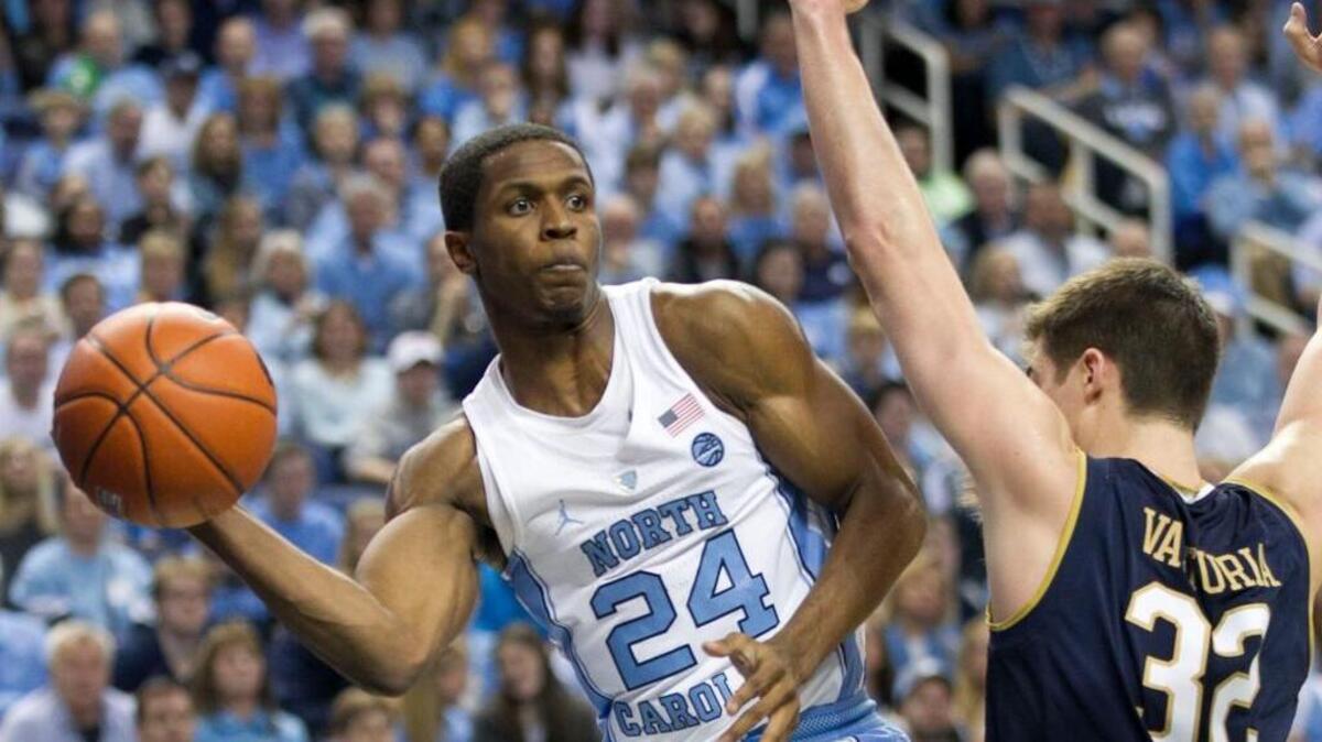 North Carolina's Kenny Williams (24) passes around Notre Dame's Steve Vasturia (32). Williams had knee surgery this week but is expected to participate in October.