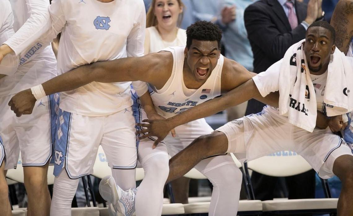 North Carolina’s Brandon Huffman (42) and Brandon Robinson (4) reacts to a dunk by teammate Cameron Johnson (13) during the second half on Monday, February 12, 2018 at the Smith Center in Chapel Hill, N.C.