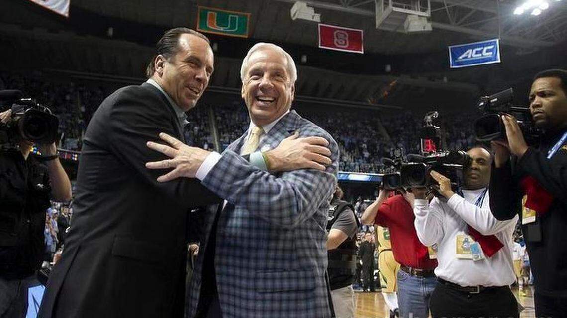 North Carolina coach Roy Williams greets Notre Dame coach Mike Brey prior to their game on Saturday, March 14, 2015 during the championship game of the Atlantic Coast Conference Basketball Tournament at the Greensboro Coliseum in Greensboro, N.C.