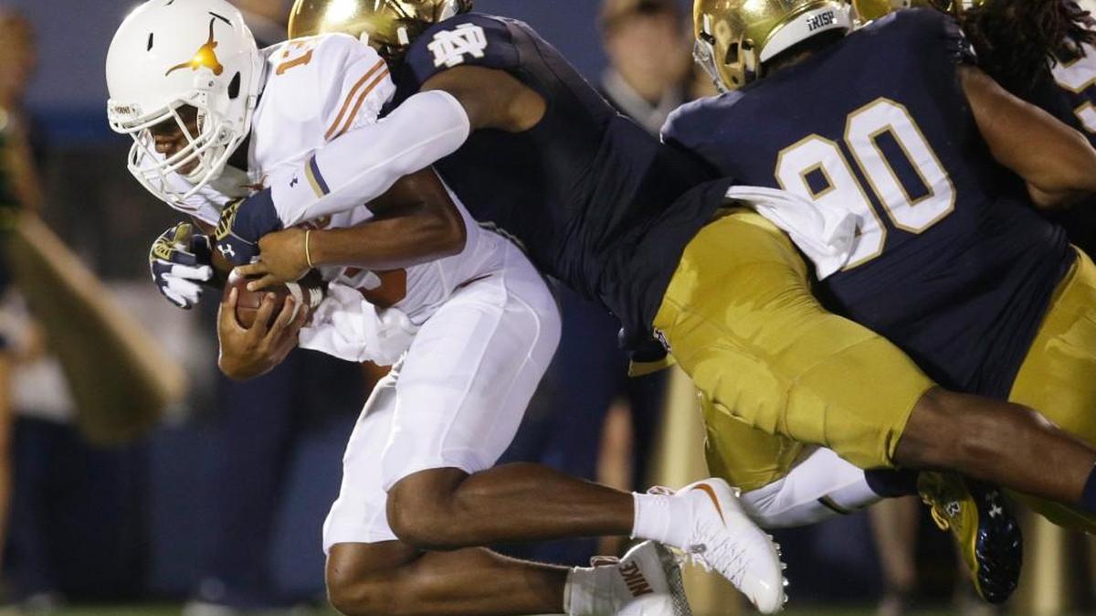 
Notre Dame linebacker Jaylon Smith, center, sacks Texas quarterback Jerrod Heard, left, during the Irish’s season opener on Sept. 5 in South Bend. Ind. Notre Dame faces Clemson Saturday and has upcoming matchups with Southern Cal and Stanford in its 12-game season. 



