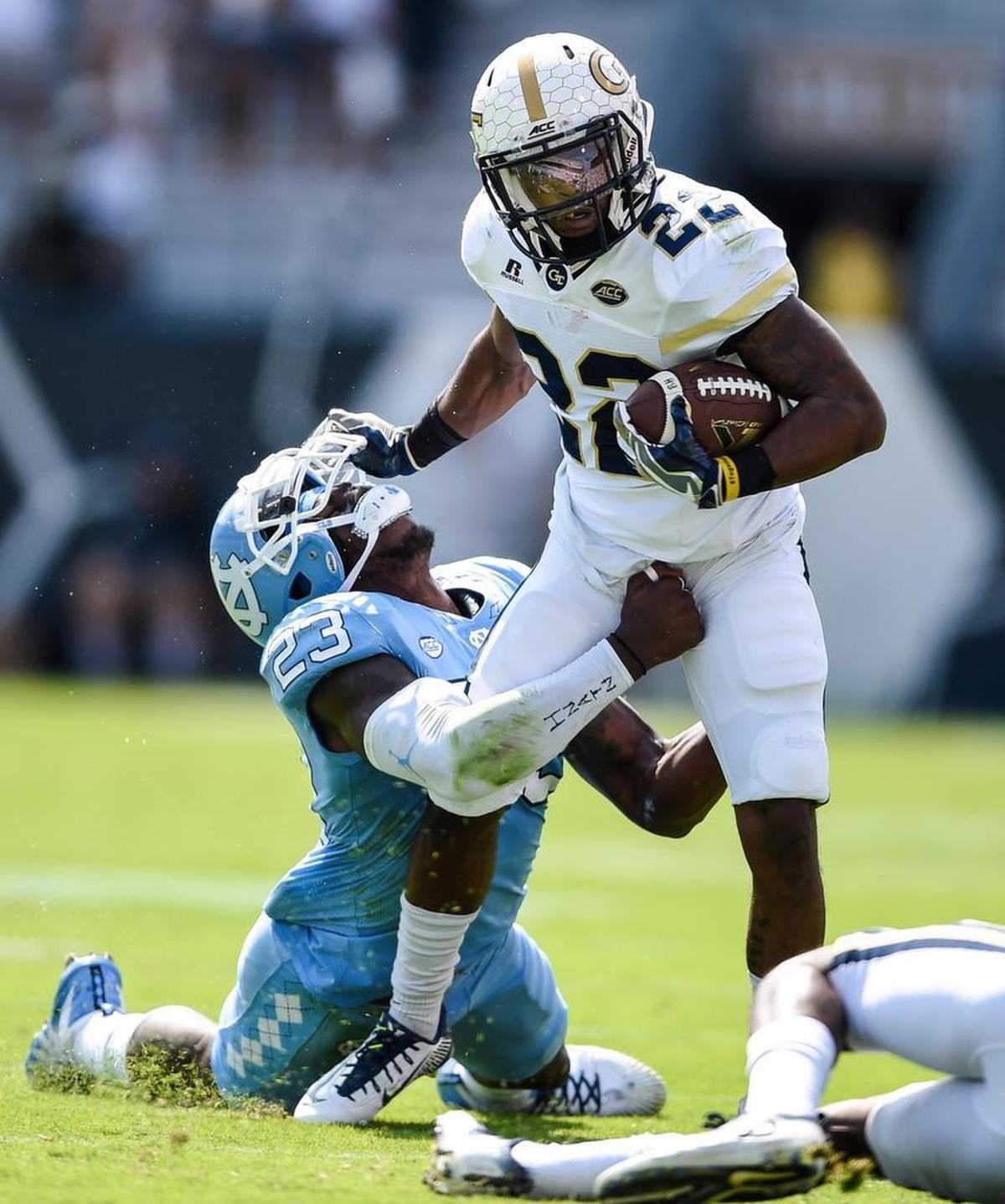 North Carolina linebacker Cayson Collins (23) tries to tackle Georgia Tech running back Clinton Lynch (22) during the first half.