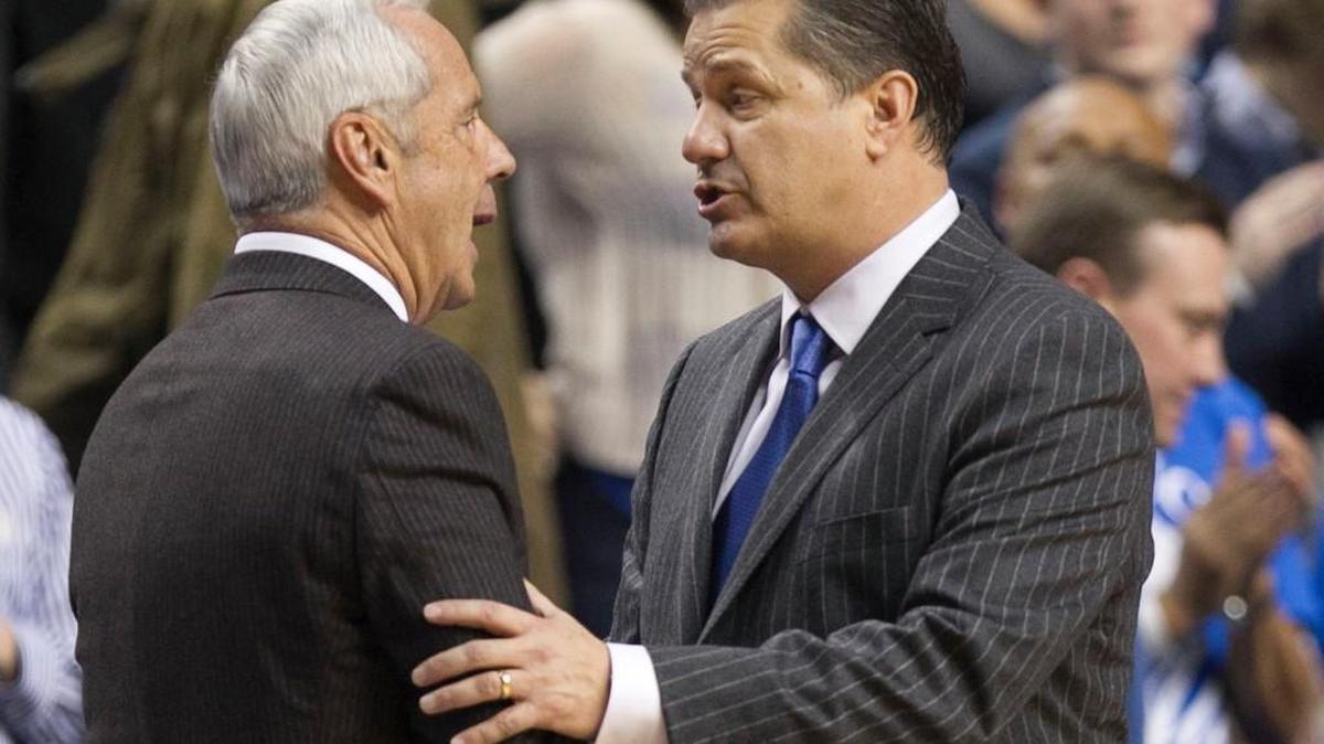Kentucky head coach John Calipari and UNC's coach Roy Williams shake hands following Kentucky's 84-70 victory on Saturday, December, 13, 2014 at Rupp Arena in Lexington, Kentucky.