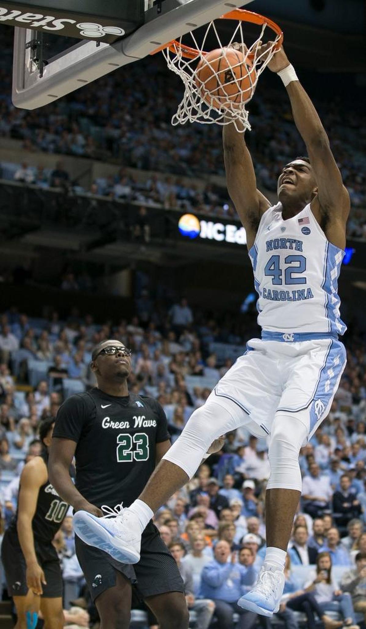 North Carolina’s Brandon Huffman (42) dunks over Tulane’s Blake Paul (23) during the first half on Sunday, December 3, 2017 at the Smith Center in Chapel Hill, N.C.
