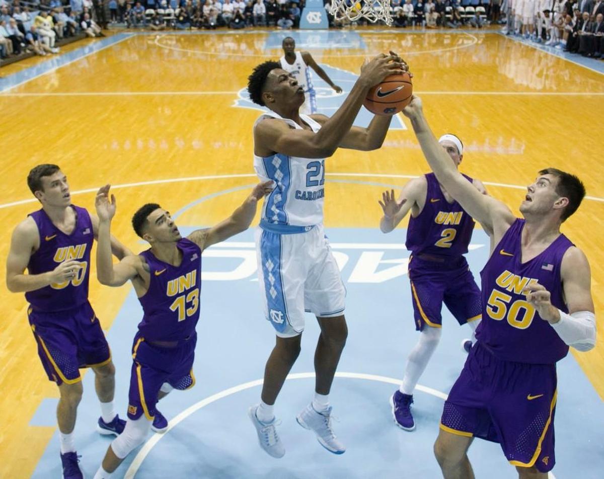 UNC’s Sterling Manley, middle, grabs an offensive rebound against Northern Iowa on Nov. 10.