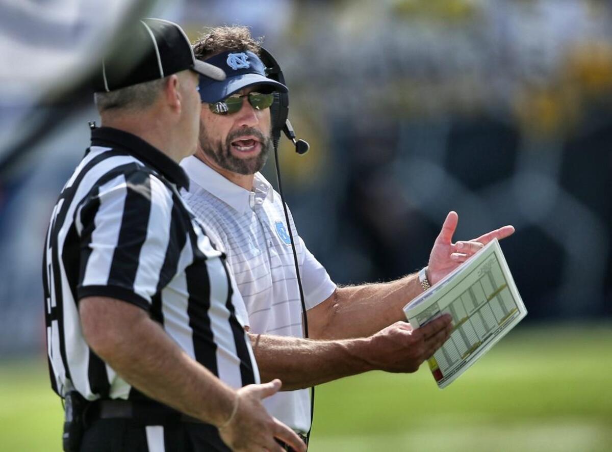 North Carolina head coach Larry Fedora talks with an official in the second half against Georgia Tech.